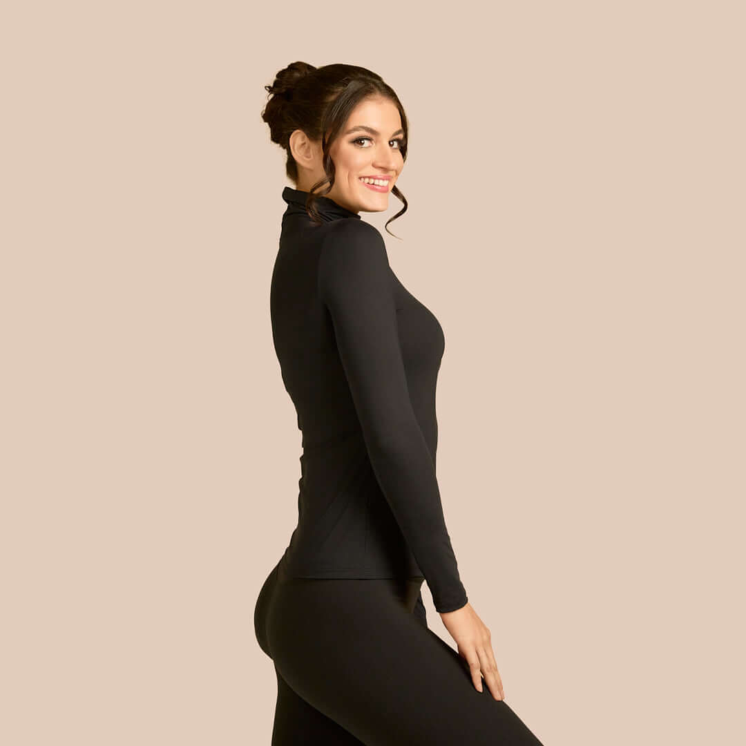 Long Sleeve Turtleneck Luxury Layering Top or Shell in Black made sustainably in the USA by Adea Clothing with silky soft Italian fabric side view.