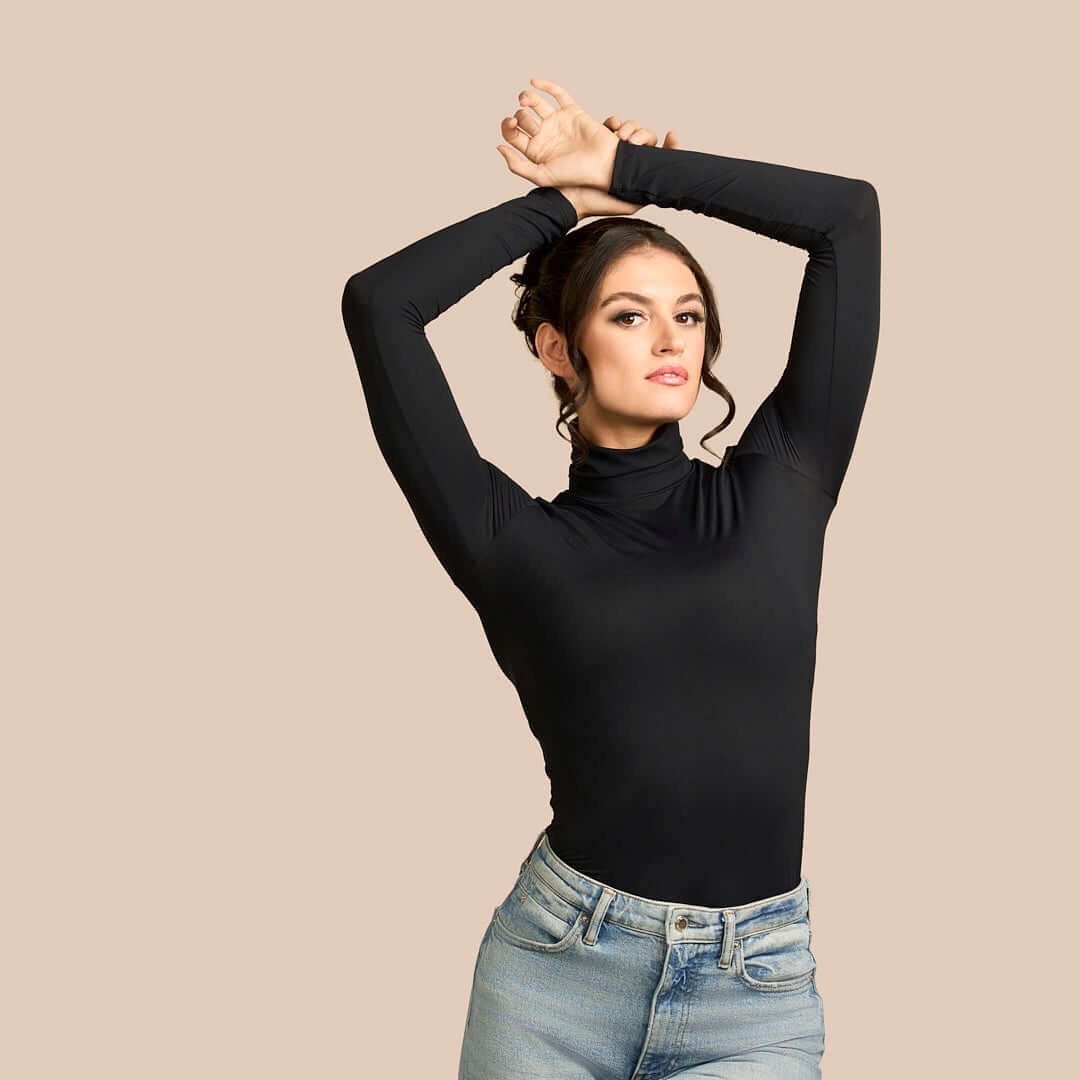 Long Sleeve Turtleneck Luxury Layering Top or Shell in Black made sustainably in the USA by Adea Clothing with silky soft Italian fabric shown with jeans.