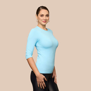 3/4 Sleeve Crew Neck Luxury Layering Top or Shell in Sky Blue made sustainably in the USA by Adea Clothing with silky soft Italian fabric V-neck side view.