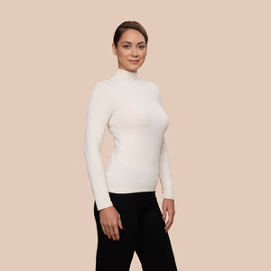Mock Neck Long Sleeve Luxury Layering Top or Shell in Off-White made sustainably in the USA by Adea Clothing with silky soft Italian fabric side view.