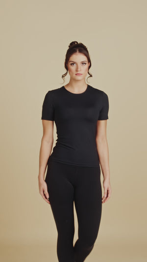 Short Sleeve Crew Neck Luxury Layering Top or Shell in Black made sustainably in the USA by Adea Clothing with silky soft Italian fabric runway video.