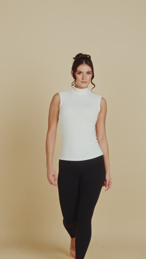 Sleeveless Mock Neck Luxury Layering Top or Shell in White made sustainably in the USA by Adea Clothing with silky soft Italian fabric runway video.