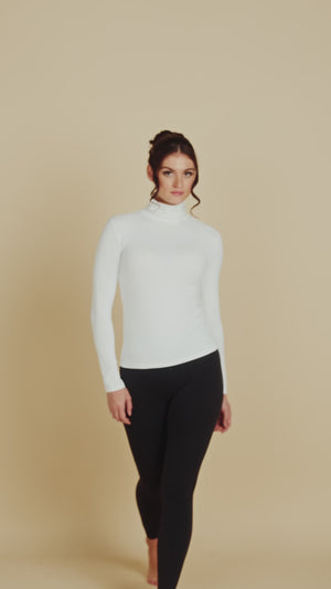 Long Sleeve Turtleneck Luxury Layering Top or Shell in White made sustainably in the USA by Adea Clothing with silky soft Italian fabric runway video