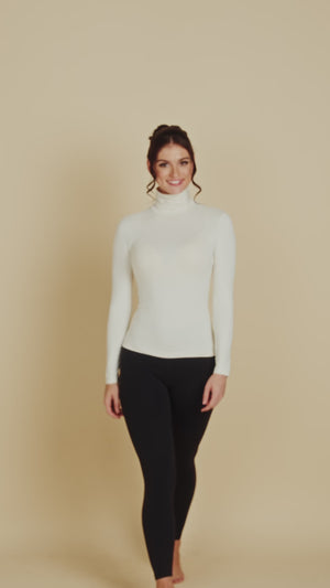 Long Sleeve Turtleneck Luxury Layering Top or Shell in Off-White made sustainably in the USA by Adea Clothing with silky soft Italian fabric runway video.