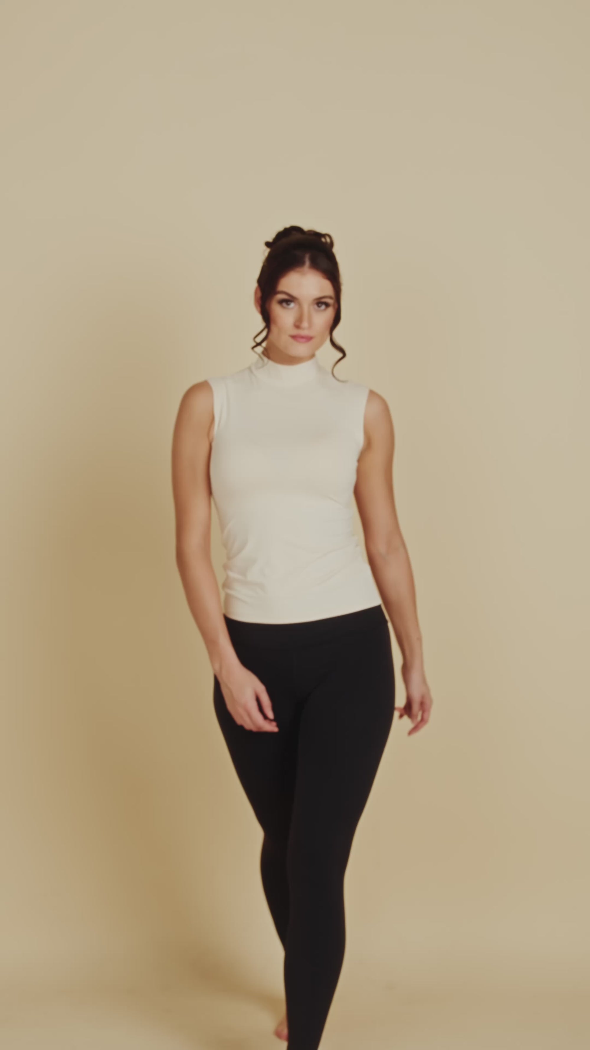 Sleeveless Mock Neck Luxury Layering Top or Shell in Off-White made sustainably in the USA by Adea Clothing with silky soft Italian fabric runway video.